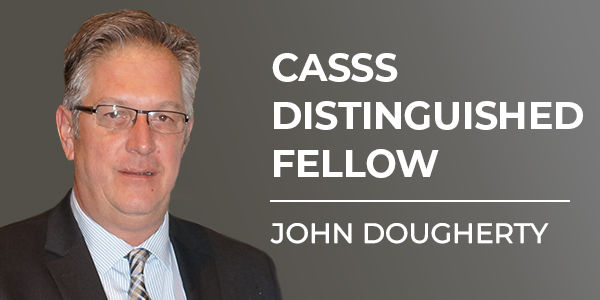 Image of male with text 'CASSS Distinguished Fellow John Dougherty'