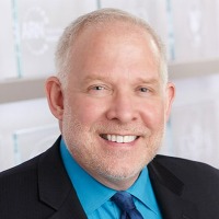 Image of male in business suit in front of white background