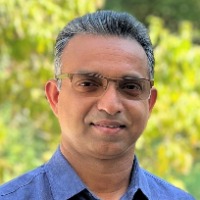 Professional headshot of male Babu Kunnel