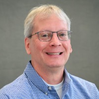 Image of male smiling for a professional headshot