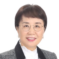 Image of female wearing glasses and business outfit