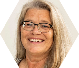 Image of woman wearing glasses in front of white background